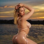 sexy blonde on beach at sunset www.baconboobsbeer.com